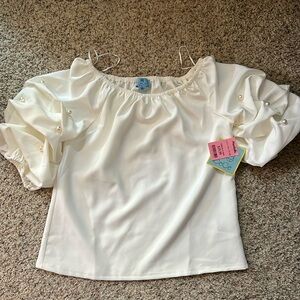 Jeweled-sleeve, white blouse. Pearl detail on sleeves.